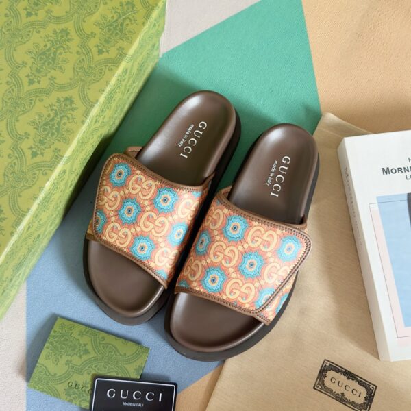Gucci men's Velcro monogram double G flip-flop beach sandals.